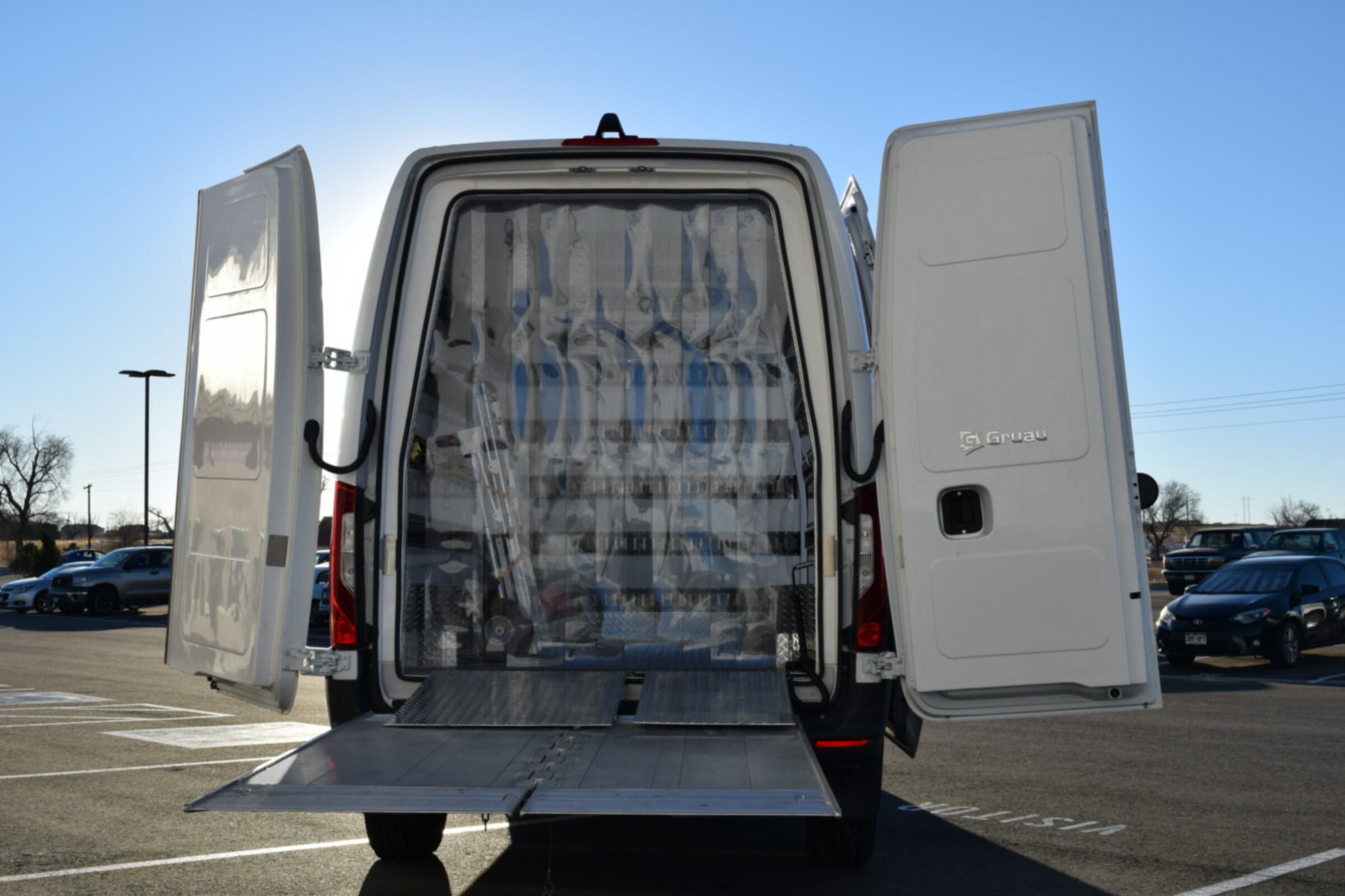 Rear of Summit Body Works refrigerated van with doors open